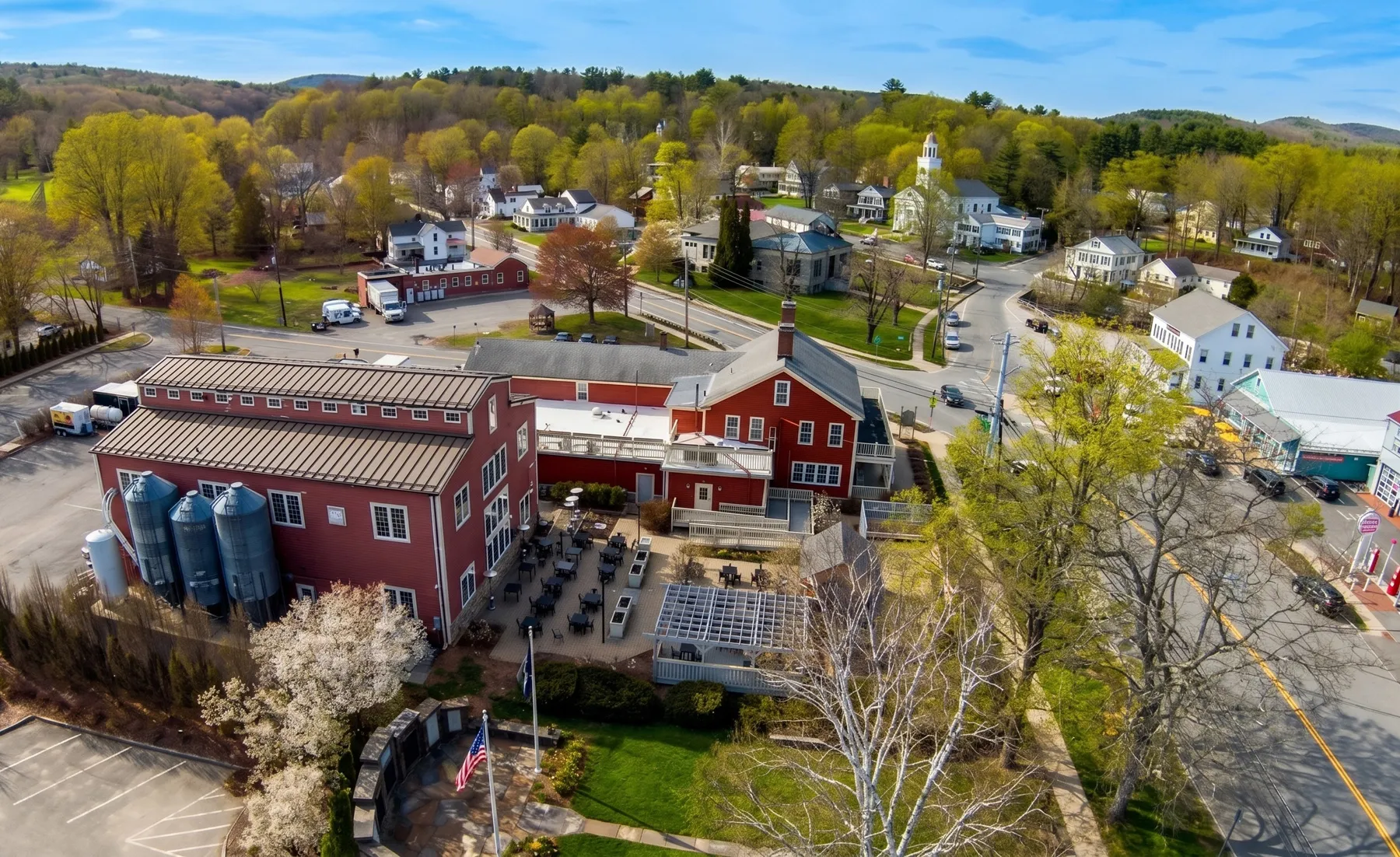 Aerial view of the Exhibit A Brewing campus and surrounding town