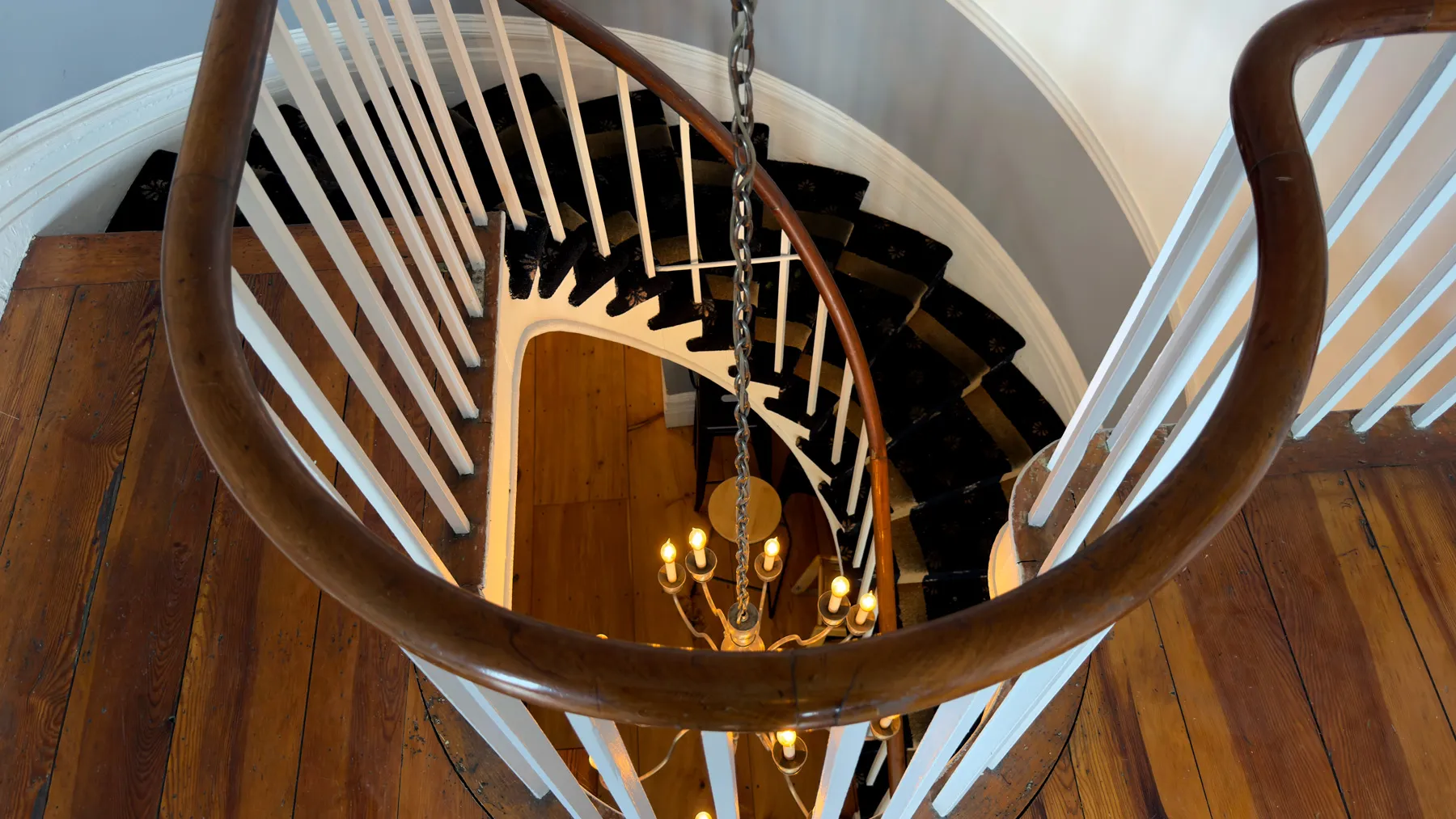 Looking down the spiral front staircase at Exhibit A